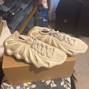 Cloud White Yeezy 450 Sneakers.